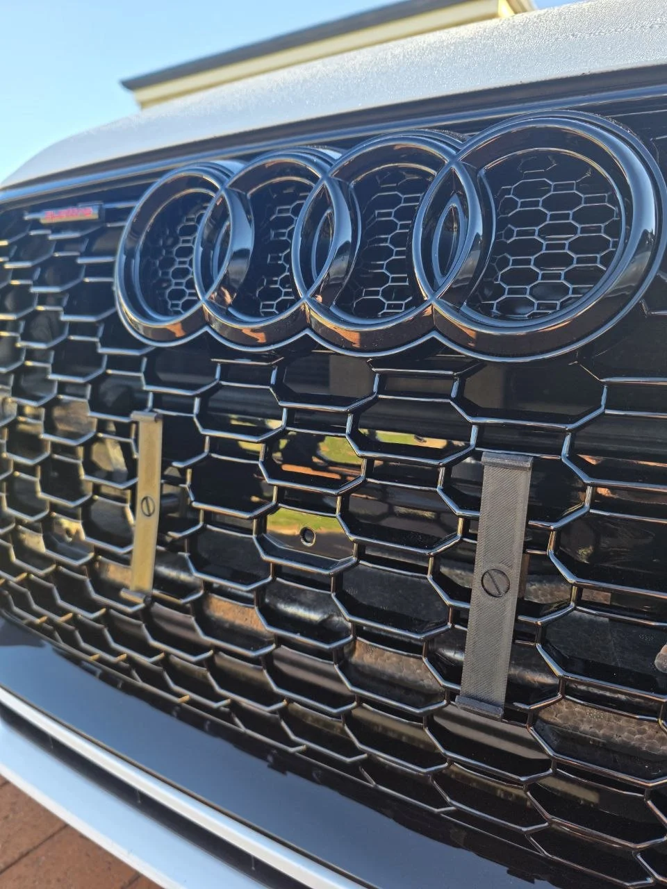 Front bracket installed — Audi honeycomb grille